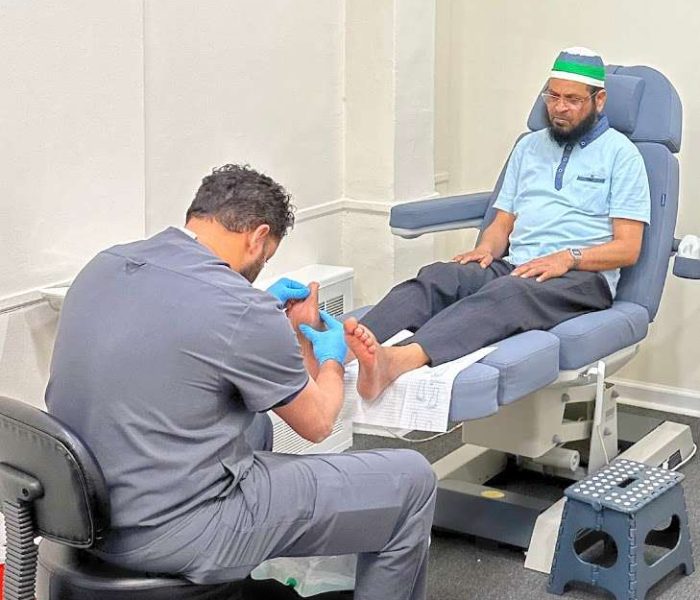 Image of Dr. Sadi Alam performing corn removal procedure in Jamaica, Queens.